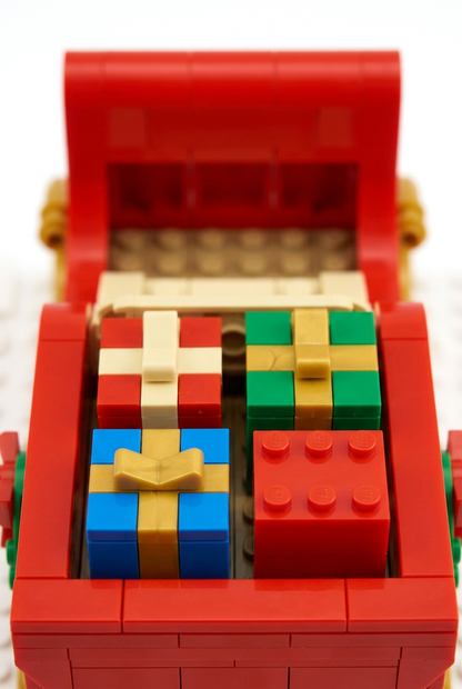 Midnight Gift Run Christmas Sleigh Building Block Toy — A Festive Red & Gold Model Concept with Colorful Presents and a Reindeer Companion